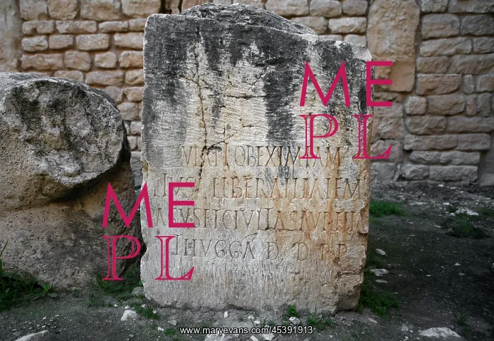 : Dougga. Low angle view of a stone inscribed with the ancient name: Thugga : Dougga. Low angle view of a stone inscribed with the ancient name: Thugga