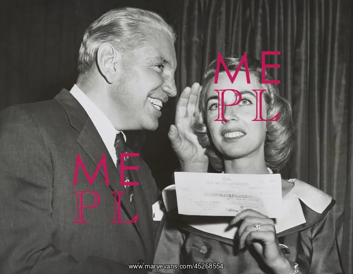 : Dr. Joyce Brothers holds her check for correctly : Dr. Joyce Brothers holds her check for correctly