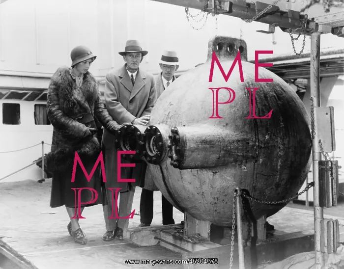 : Dr. William Beebe (center) standing with ? : Dr. William Beebe (center) standing with ?