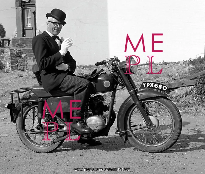 : Well dressed man on a motorcycle : Well dressed man on a motorcycle