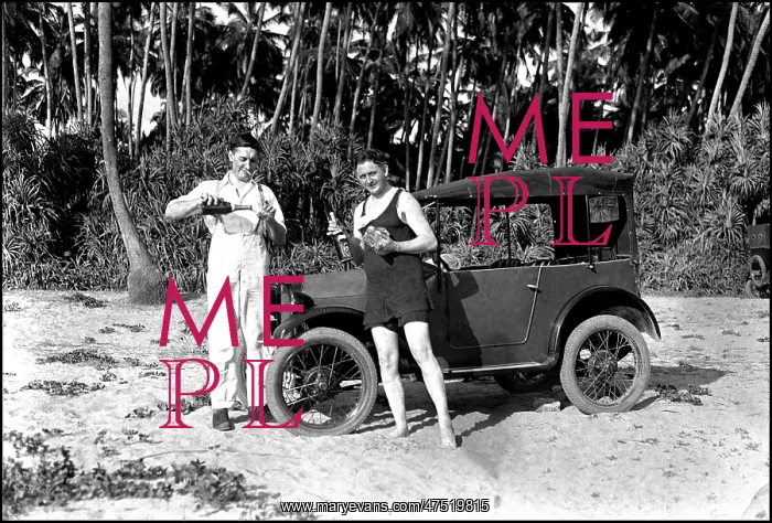 : Drinking by an Austin 7 car on the beach : Drinking by an Austin 7 car on the beach