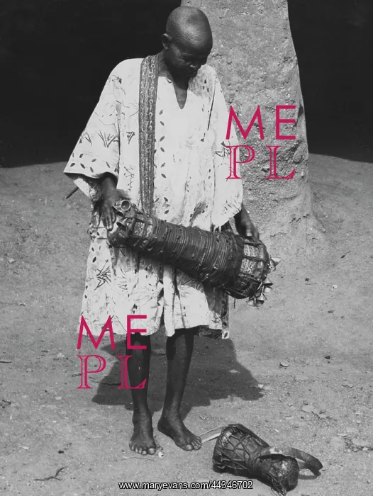 : Drummer playing Bata drum. See article by Ulli Beier : Drummer playing Bata drum. See article by Ulli Beier
