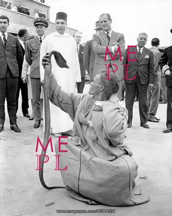 : Duke of Edinburgh watching snake charmer, Morocco : Duke of Edinburgh watching snake charmer, Morocco