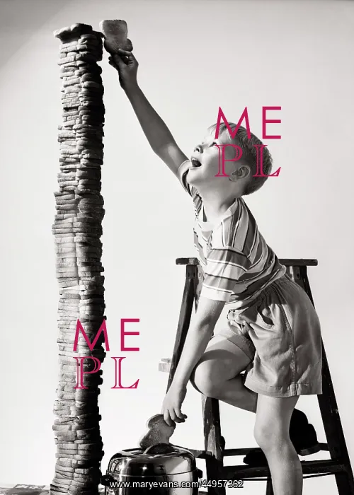 : Eager Boy Standing on Step Ladder Reaching the : Eager Boy Standing on Step Ladder Reaching the