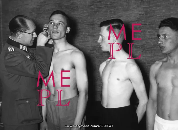 : Ear examination at a muster, 1936 : Ear examination at a muster, 1936
