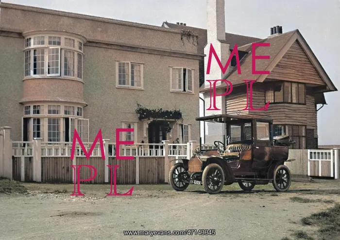 : Early car parked in front of house : Early car parked in front of house
