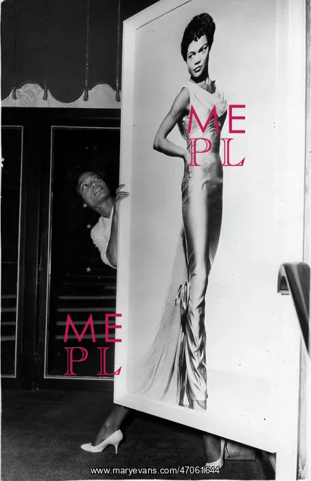 : Eartha Kitt, singer, with large portrait, Talk of the Town : Eartha Kitt, singer, with large portrait, Talk of the Town