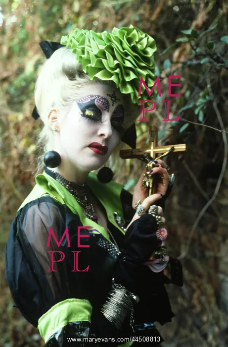  : Ecentric lady holding a Crucifix