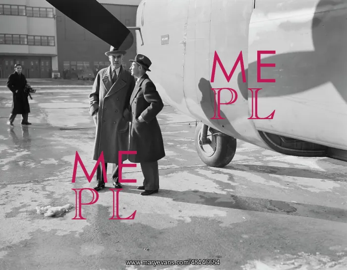 : Edsel Ford (right) stands beside a new B-24E : Edsel Ford (right) stands beside a new B-24E