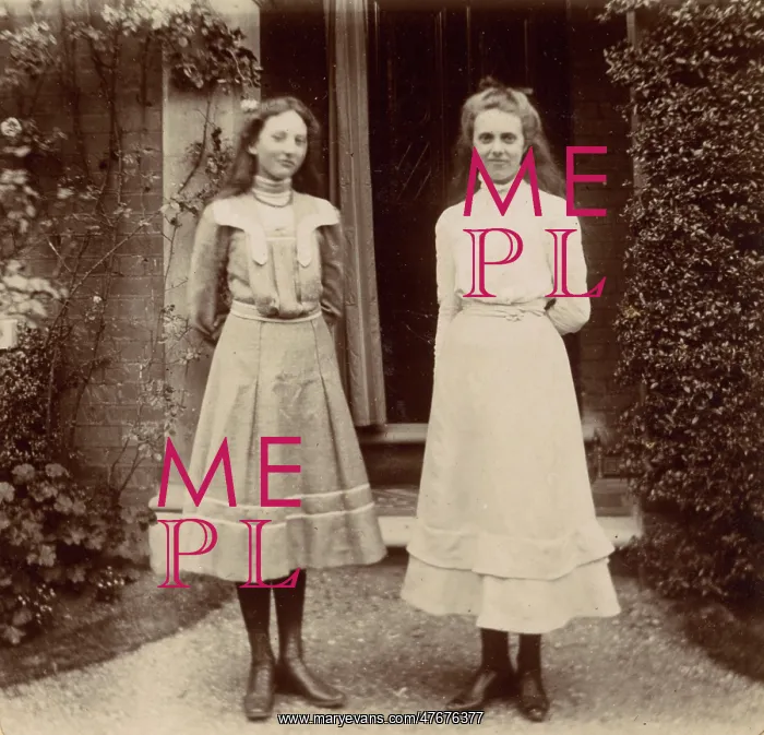 : Two Edwardian girls in a garden : Two Edwardian girls in a garden