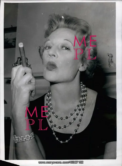 : Eileen Peel, actress, practises cigar smoking for stage role : Eileen Peel, actress, practises cigar smoking for stage role