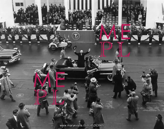 : Eisenhower waves from an open car in the inaugural : Eisenhower waves from an open car in the inaugural