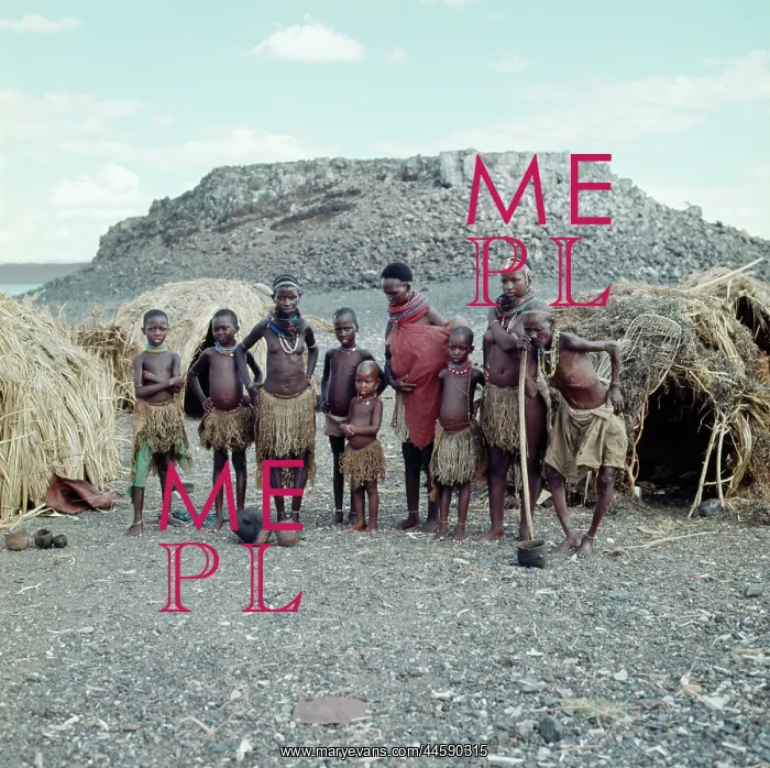 : El Molo tribe standing in front of the domed huts : El Molo tribe standing in front of the domed huts