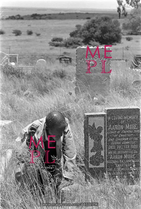 : An elder visits the grave of an ancestor in Mogopa : An elder visits the grave of an ancestor in Mogopa