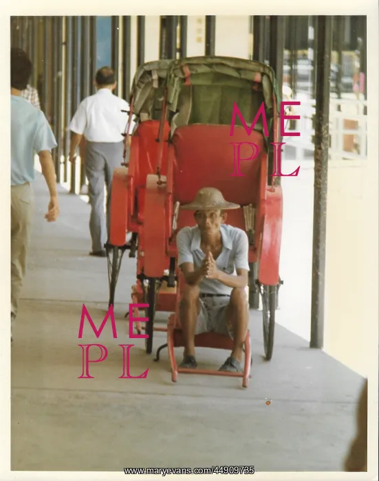 : Elderly Chinese man in an empty red rickshaw : Elderly Chinese man in an empty red rickshaw