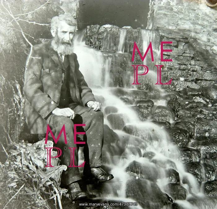 : Elderly man sitting by mill outflow : Elderly man sitting by mill outflow