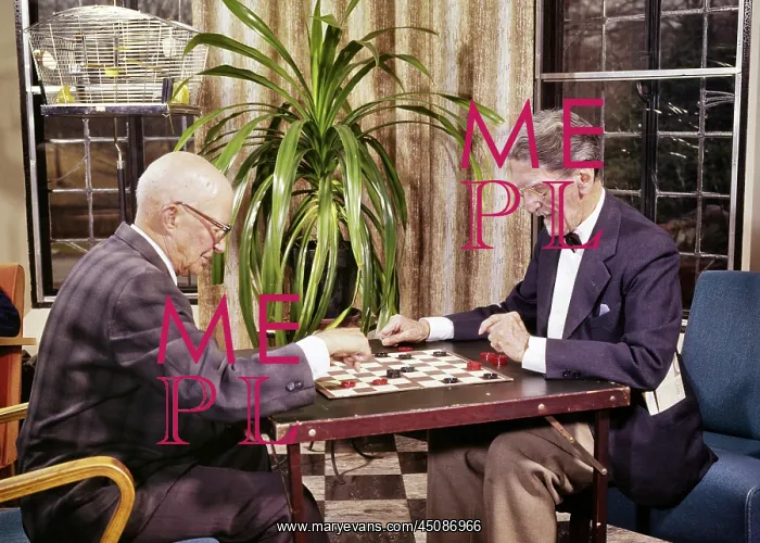 : Two Elderly Men Playing a Game of Checkers in Lounge : Two Elderly Men Playing a Game of Checkers in Lounge
