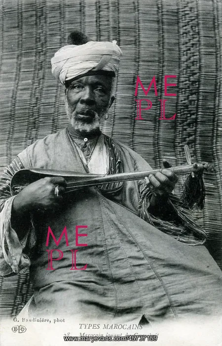 : Elderly Moroccan man of the Gnawa playing a sintir : Elderly Moroccan man of the Gnawa playing a sintir