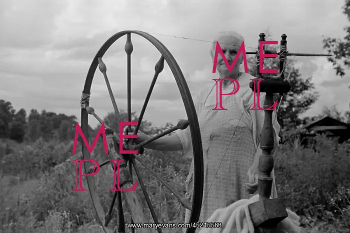 : Elderly woman at her spinning wheel in the ? : Elderly woman at her spinning wheel in the ?