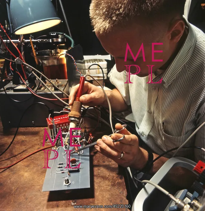 : An electrical engineer applies a soldering ? : An electrical engineer applies a soldering ?