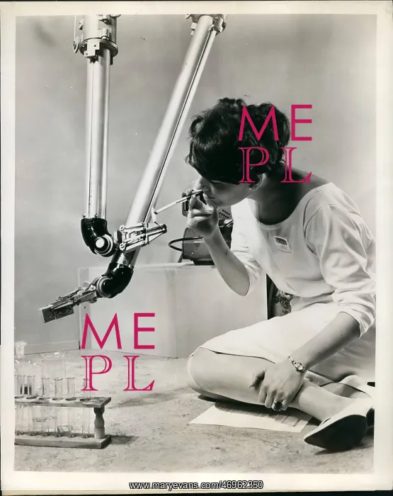 : Electronic instrument by Pye lights cigarette at exhibition : Electronic instrument by Pye lights cigarette at exhibition