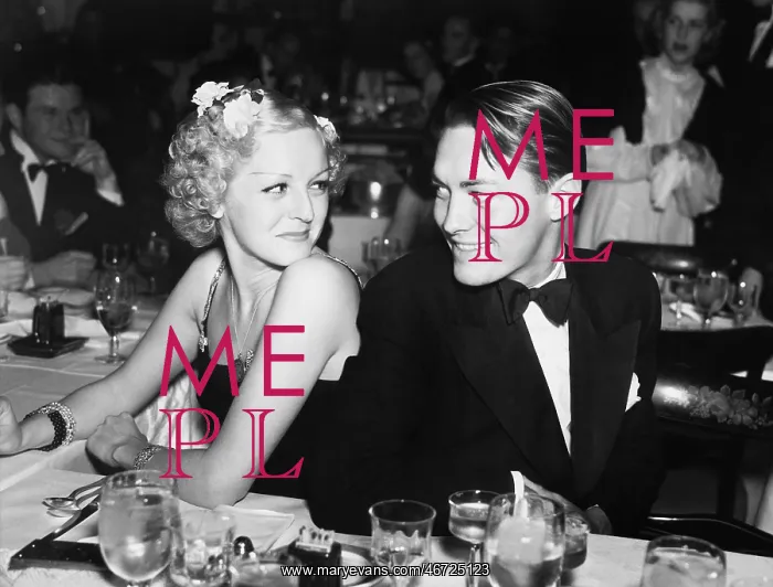 : Elegant couple sitting together and looking at each other : Elegant couple sitting together and looking at each other