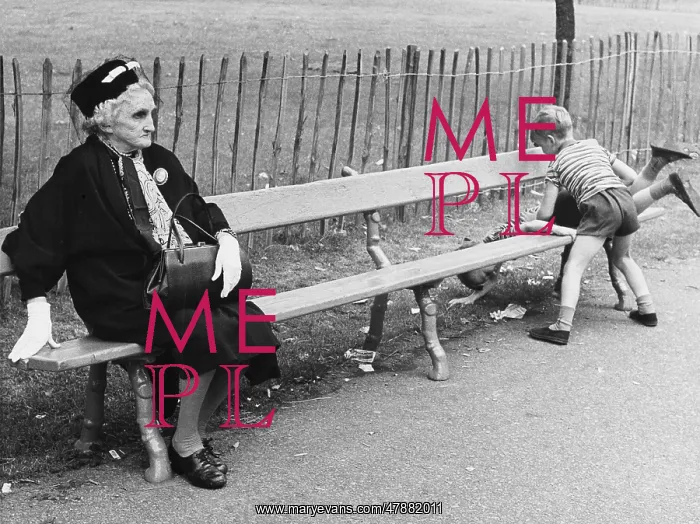 : Elegant Elderly lady on a park bench with two unruly boys : Elegant Elderly lady on a park bench with two unruly boys