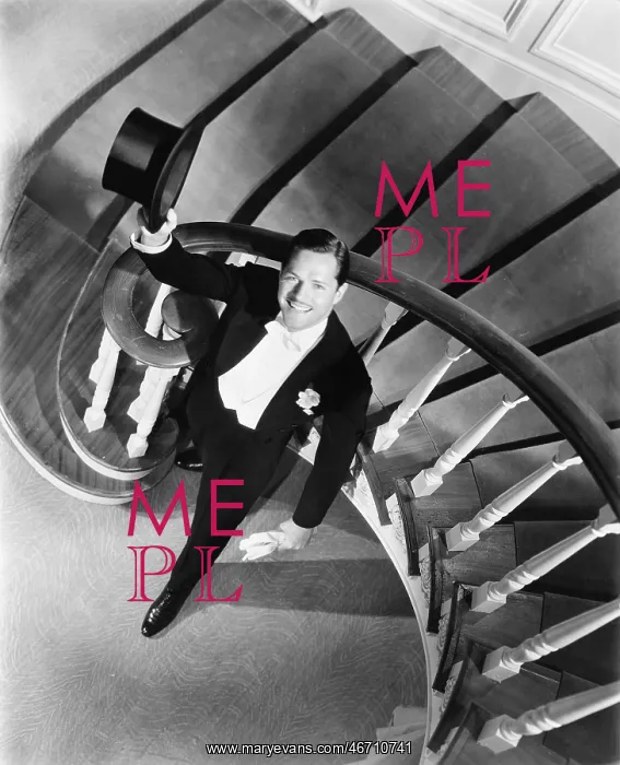: Elegant man looking up from the bottom of a staircase : Elegant man looking up from the bottom of a staircase