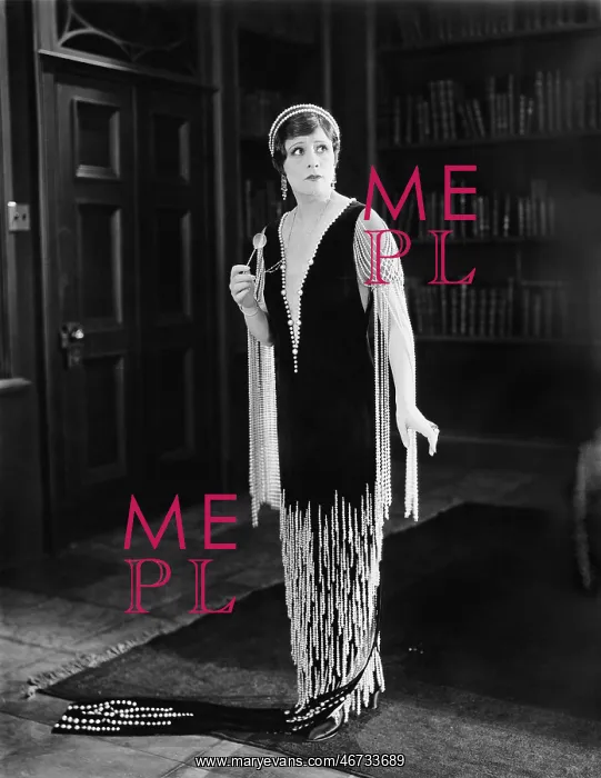 : Elegant woman standing in a library : Elegant woman standing in a library