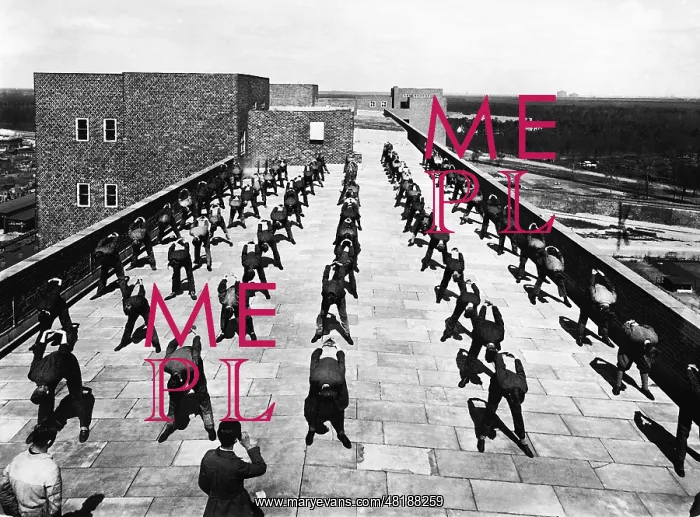 : Employees are doing gymnastics on the rooftop of Siemens-Sch : Employees are doing gymnastics on the rooftop of Siemens-Sch