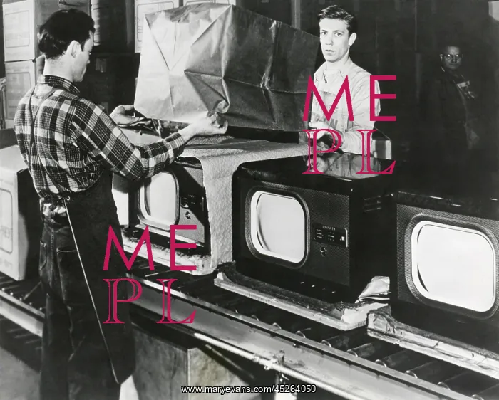 : At the end of the assembly line, inspected televisions : At the end of the assembly line, inspected televisions