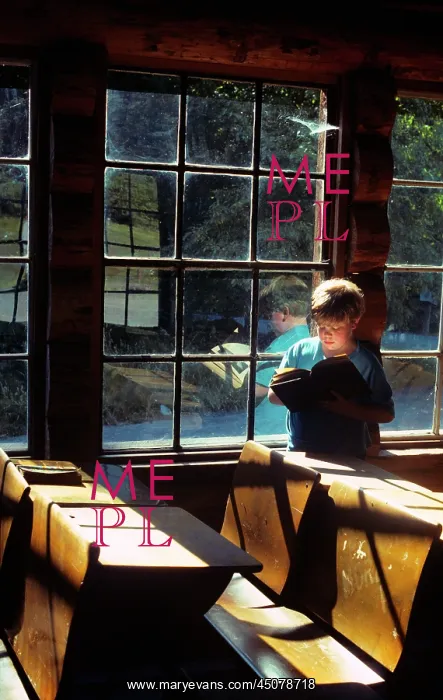 : Engaged Curious Boy Reading Book While Visiting : Engaged Curious Boy Reading Book While Visiting