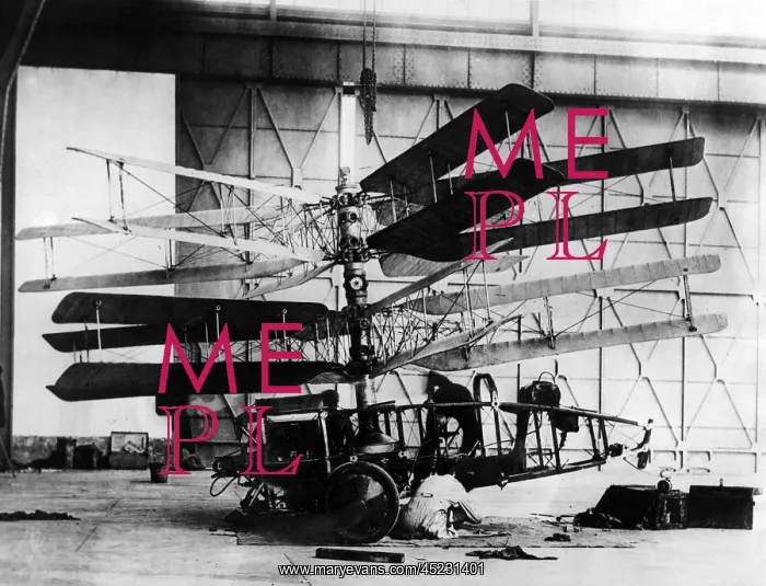 : Engineer working on the Pescarra Helicopter. ? : Engineer working on the Pescarra Helicopter. ?
