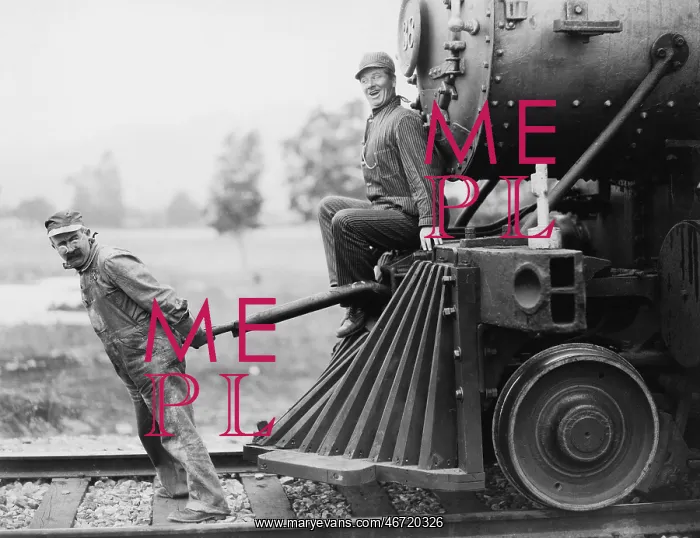 : Engineers pulling train engine : Engineers pulling train engine