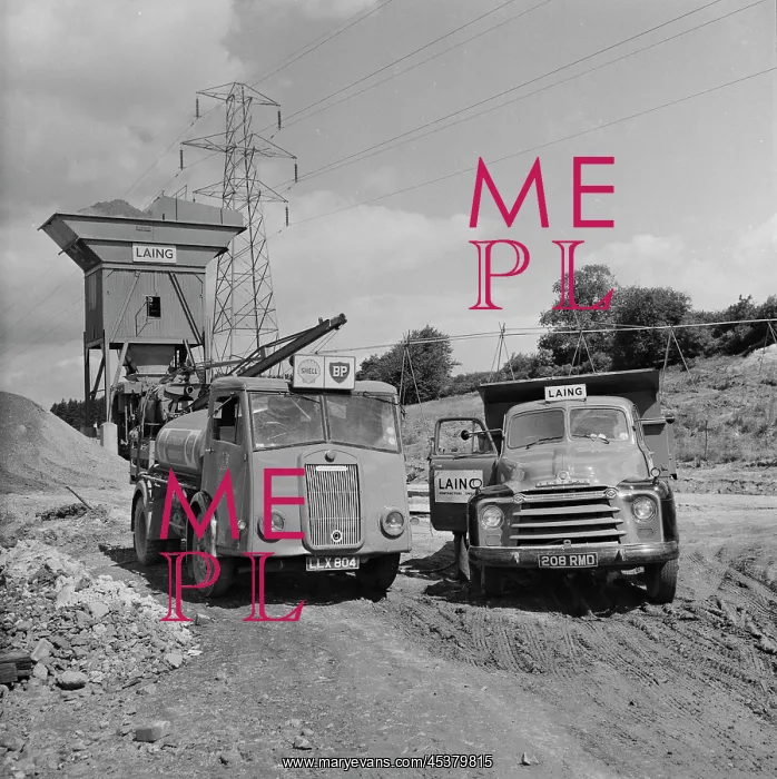 : England. A Shell-BP fuel tanker and a Laing truck at a concrete batching : England. A Shell-BP fuel tanker and a Laing truck at a concrete batching