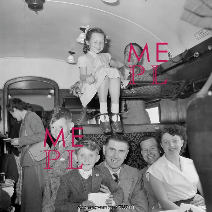 : England - Laing staff and family members inside a train carriage during : England - Laing staff and family members inside a train carriage during