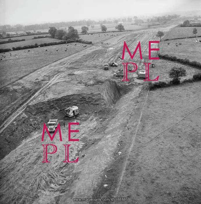 : England - An aerial view of construction vehicles carrying out excavation : England - An aerial view of construction vehicles carrying out excavation