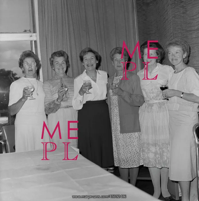 : England - A group of six women posed with celebratory drinks at the retirement : England - A group of six women posed with celebratory drinks at the retirement