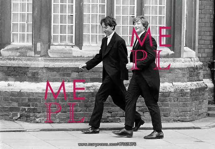 : Eton boys. Two Eton boys walk to school in Eton town, Berkshire : Eton boys. Two Eton boys walk to school in Eton town, Berkshire