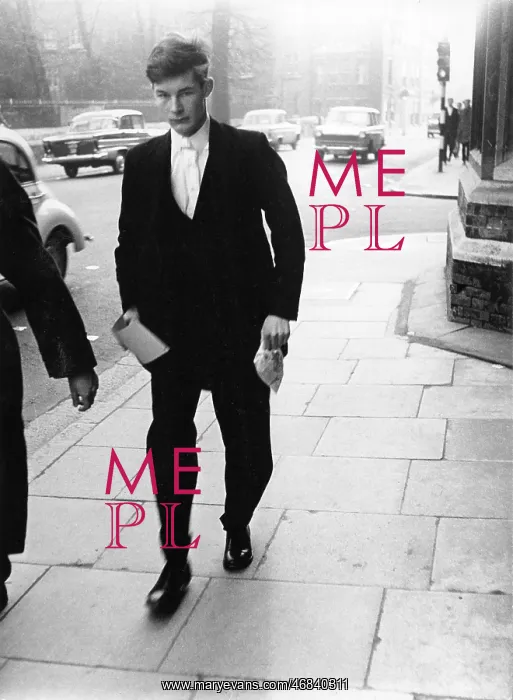 : Eton schoolboy walking along the street : Eton schoolboy walking along the street