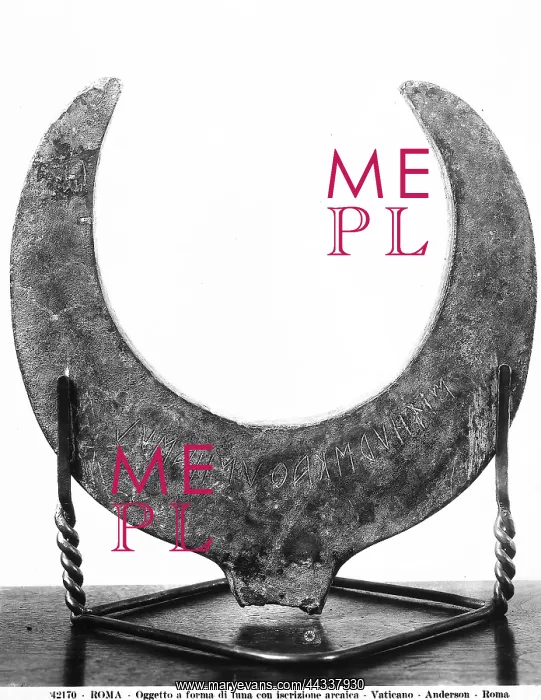 : Etruscan moon-shaped object with an : Etruscan moon-shaped object with an