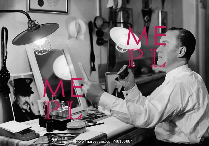 : Eugen Rex puts on make up in his dressing room : Eugen Rex puts on make up in his dressing room