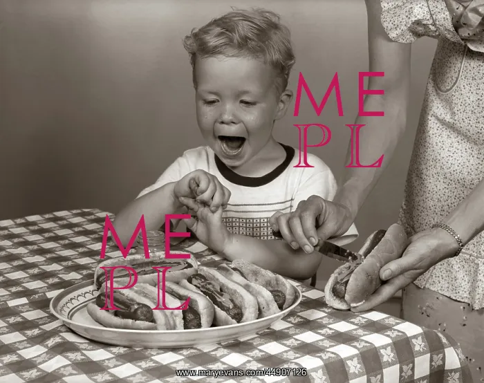 : Excited boy at table with checkered tablecloth : Excited boy at table with checkered tablecloth