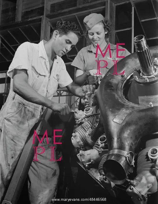: An expert mechanic shows a student the tricks : An expert mechanic shows a student the tricks