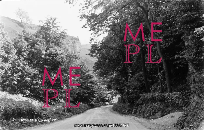  : Eyam Dale. This black and white photograph captures a winding road through Eyam Dale