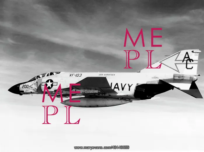 : An F-4J Phantom fighter aircraft flying over : An F-4J Phantom fighter aircraft flying over