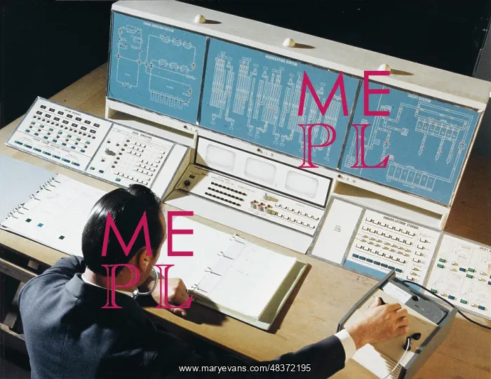 : Factory technician at the control desk : Factory technician at the control desk