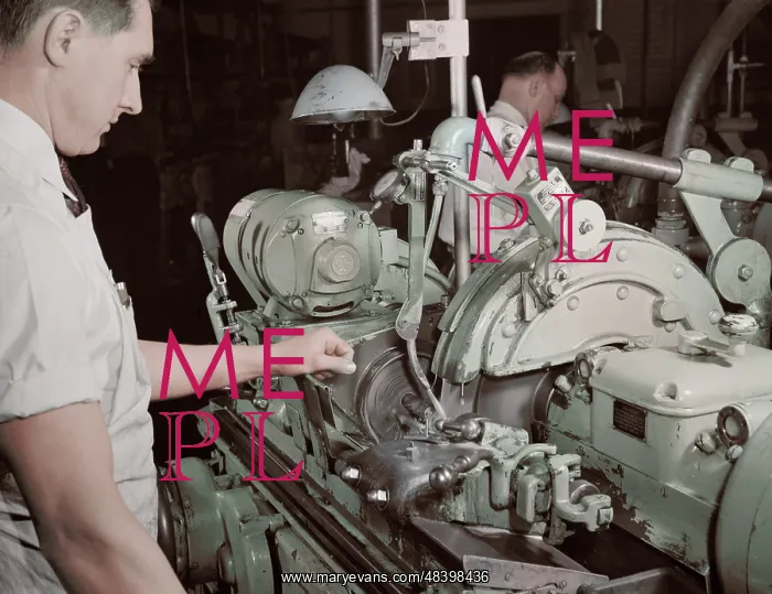 : Factory worker making spring collets to further : Factory worker making spring collets to further