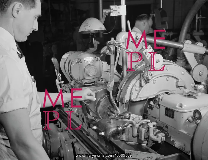 : Factory worker making spring collets to further : Factory worker making spring collets to further