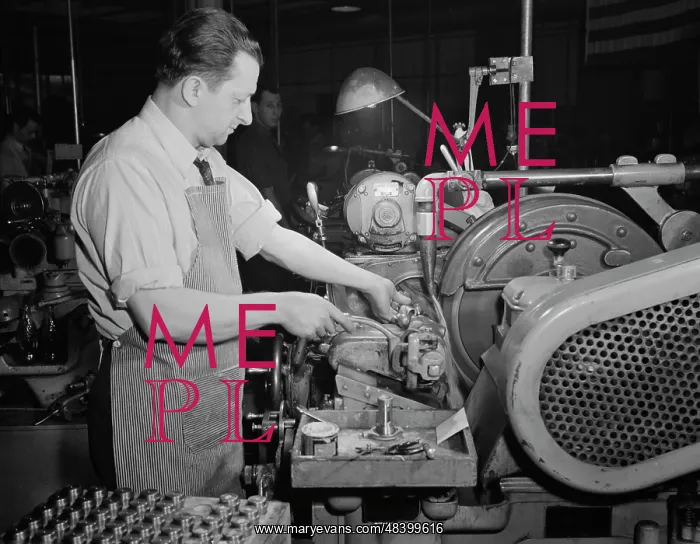 : Factory worker making spring collets to further : Factory worker making spring collets to further